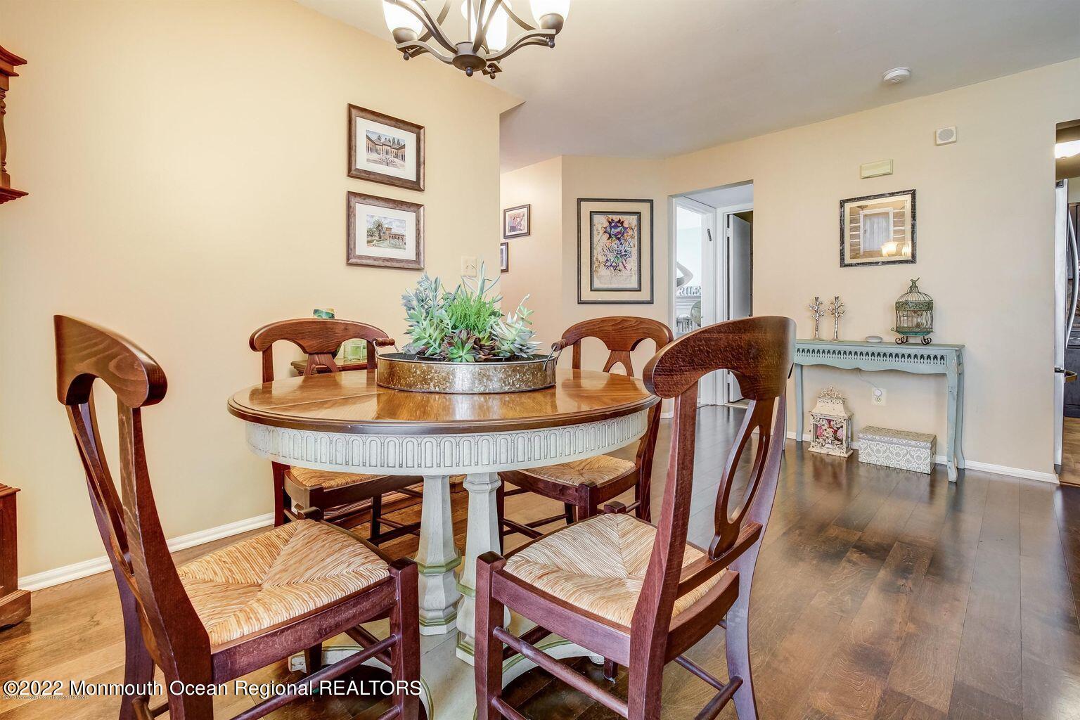 123 Hyacinth Lane Freehold, NJ 07728 - Photo 13 of 28 a view of a dining room with furniture and wooden floor
