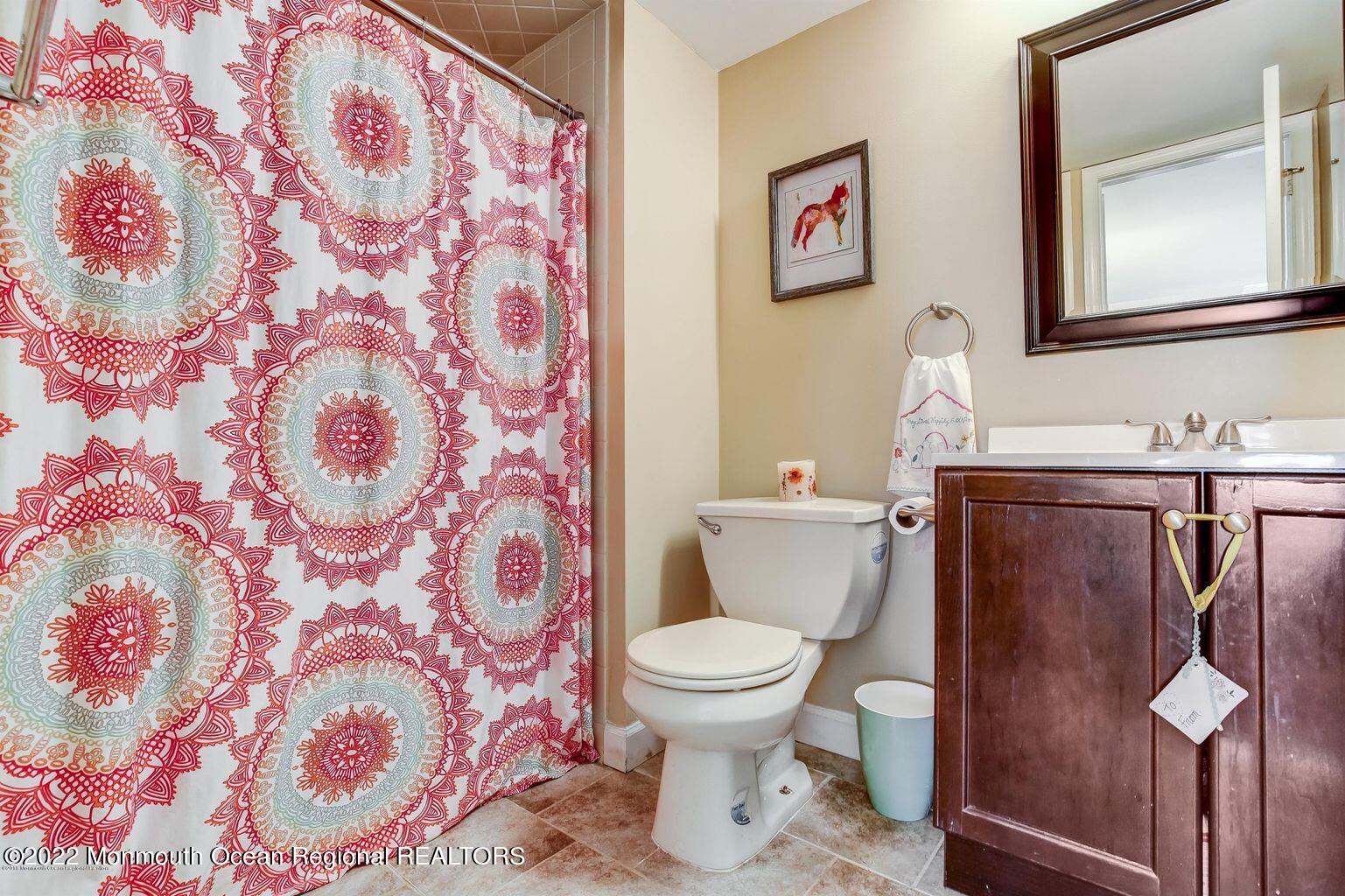 123 Hyacinth Lane Freehold, NJ 07728 - Photo 18 of 28 a bathroom with a toilet and a sink