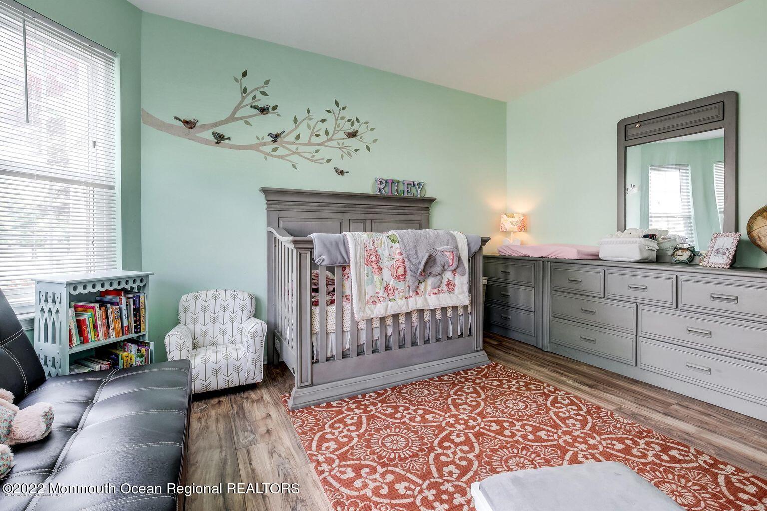 123 Hyacinth Lane Freehold, NJ 07728 - Photo 20 of 28 a bedroom with furniture and wooden floor