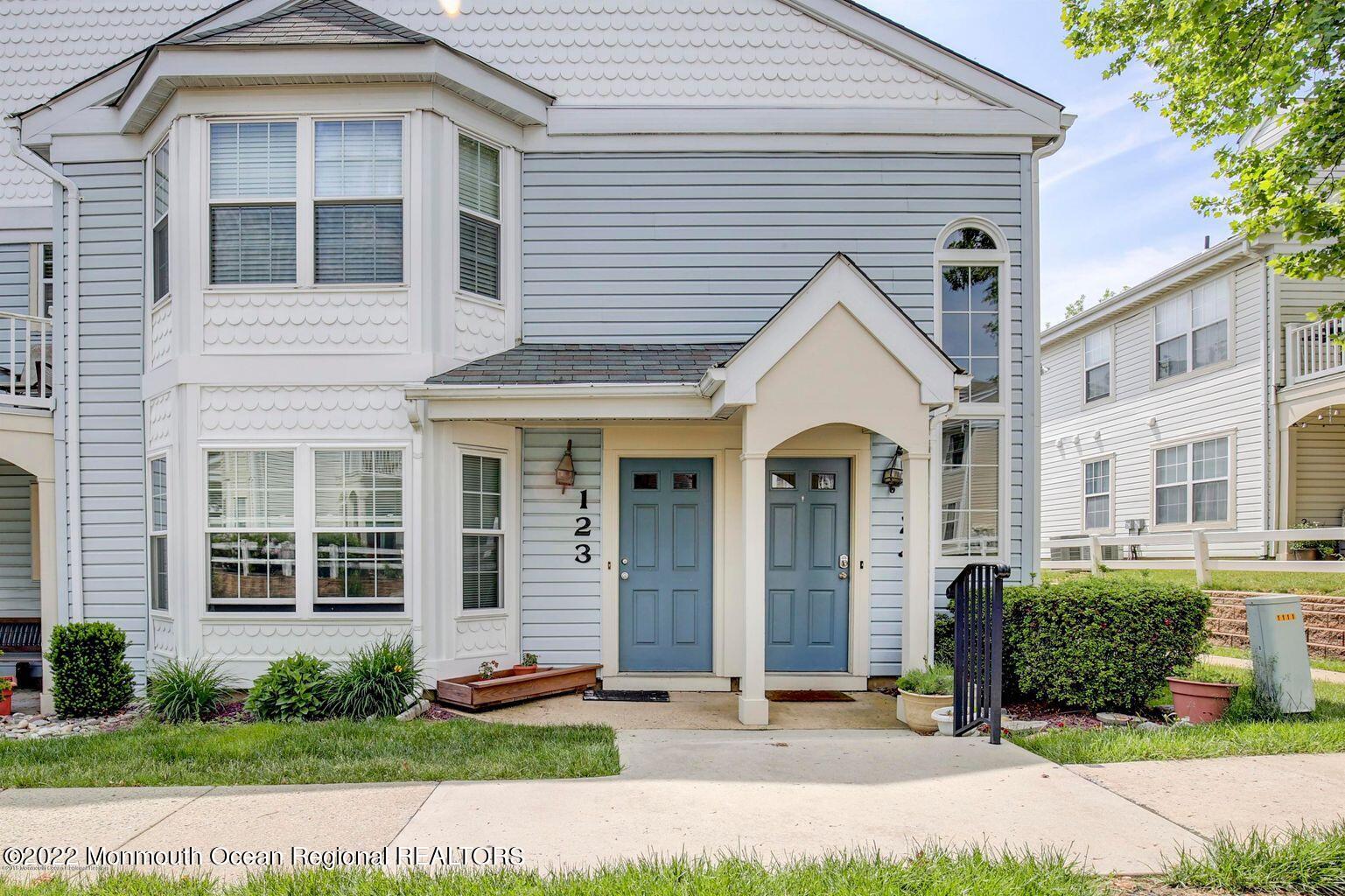 123 Hyacinth Lane Freehold, NJ 07728 - Photo 2 of 28 a front view of a house with garden