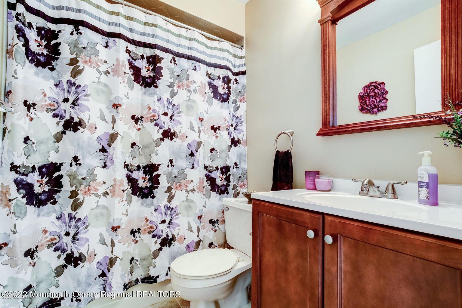 123 Hyacinth Lane Freehold, NJ 07728 - Photo 21 of 28 a bathroom with a toilet sink and mirror