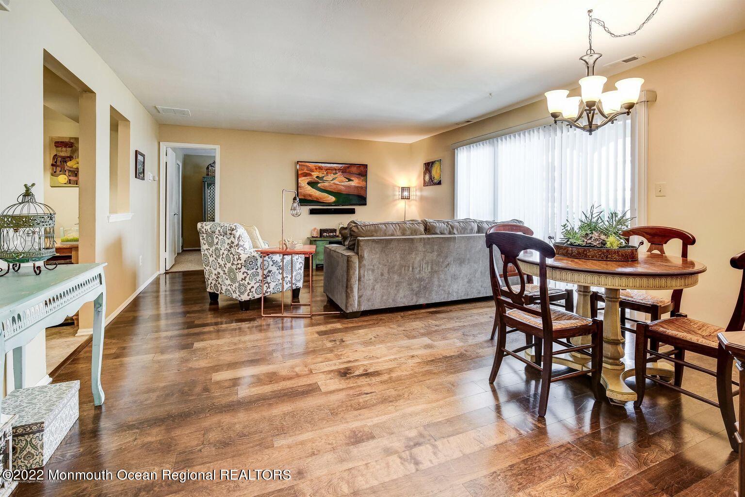 123 Hyacinth Lane Freehold, NJ 07728 - Photo 4 of 28 a view of a dining room with furniture and chandelier