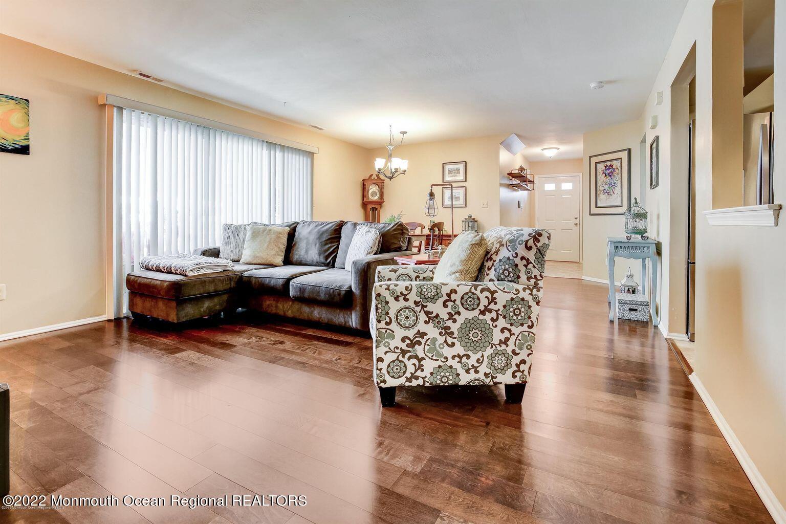 123 Hyacinth Lane Freehold, NJ 07728 - Photo 6 of 28 a living room with furniture and a wooden floor