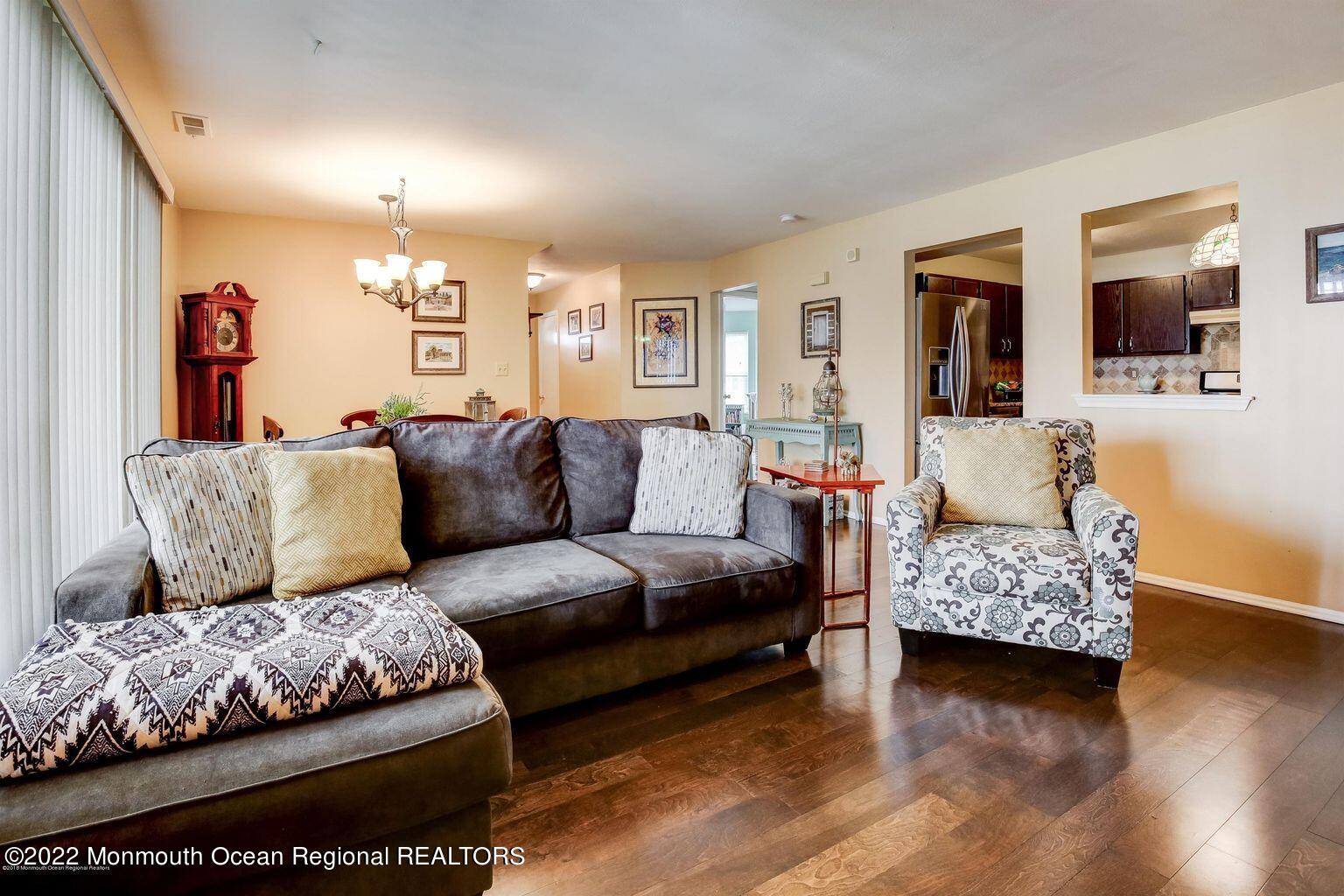 123 Hyacinth Lane Freehold, NJ 07728 - Photo 7 of 28 a living room with furniture and wooden floor