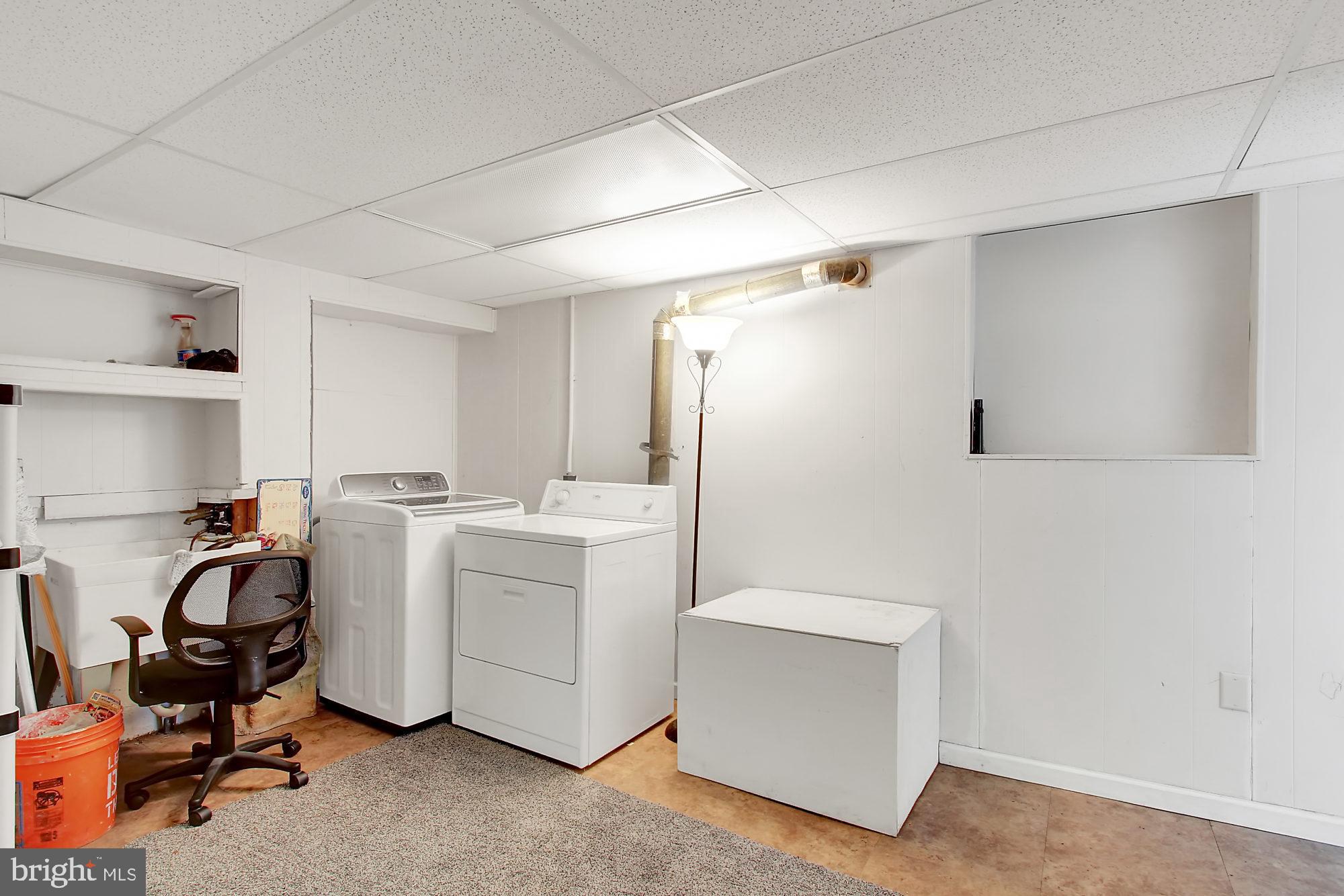 7817 Lockwood Road Baltimore, MD 21222 - Photo 20 of 23 a view of a storage & utility room with a washer dryer