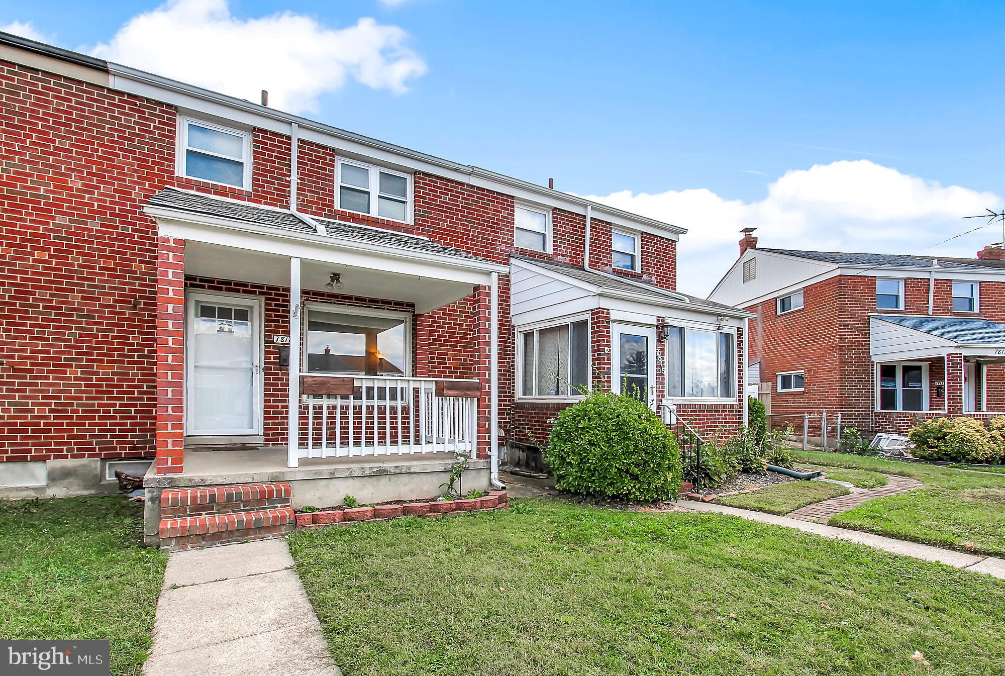 7817 Lockwood Road Baltimore, MD 21222 - Photo 23 of 23 a front view of a house with a garden