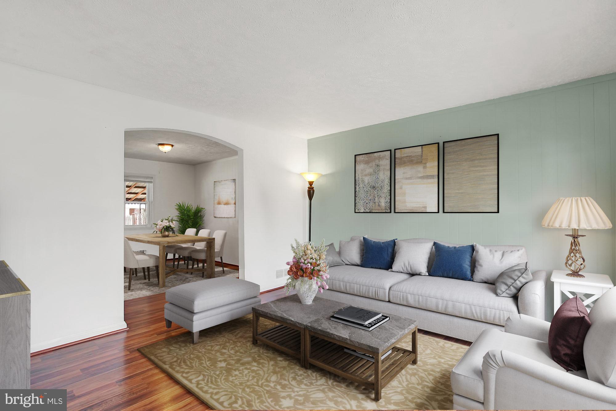 7817 Lockwood Road Baltimore, MD 21222 - Photo 5 of 23 a living room with furniture and wooden floor