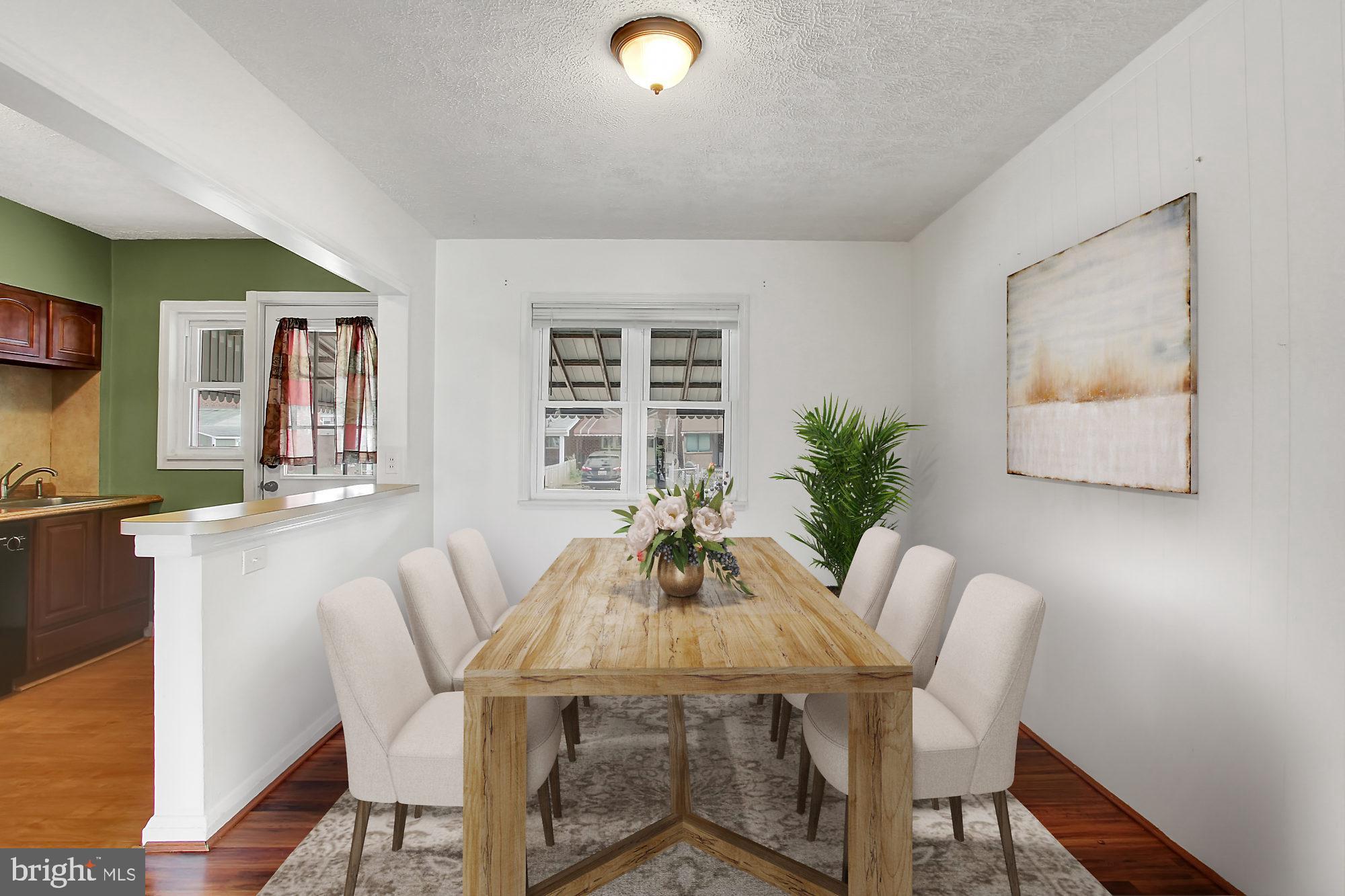 7817 Lockwood Road Baltimore, MD 21222 - Photo 7 of 23 a view of a dining room with furniture and window