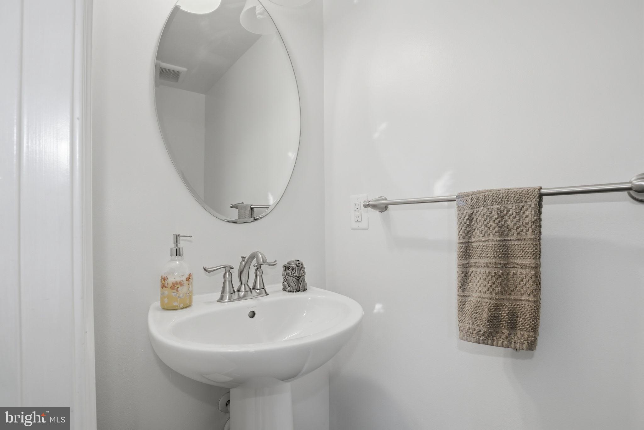 2784 Fredericksburg Road Hanover, MD 21076 - Photo 13 of 60 a bathroom with a sink a shower and a mirror