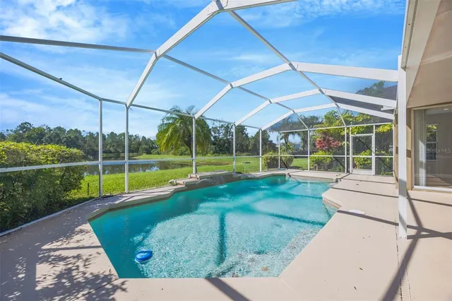 a view of a backyard with swimming pool