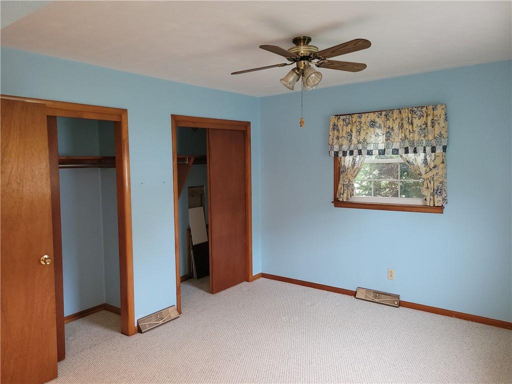 3143 Georgetown Road Polk, PA 16342 - Photo 5 of 15 an empty room with a ceiling fan and a window