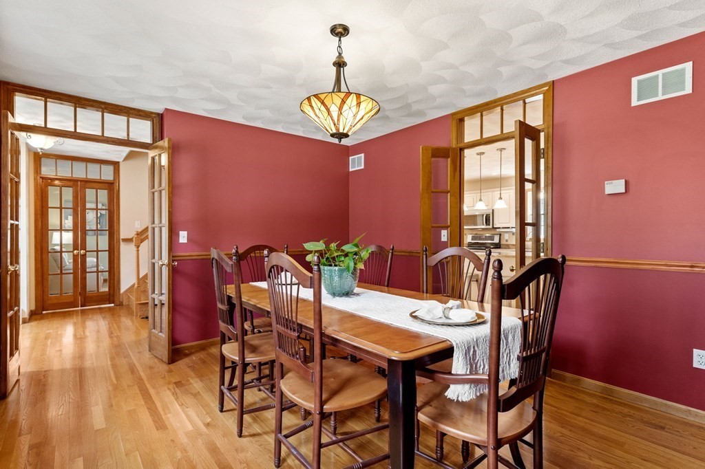 628 Boston Road Groton, MA 01450 - Photo 10 of 32 a view of a dining room with furniture window and wooden floor