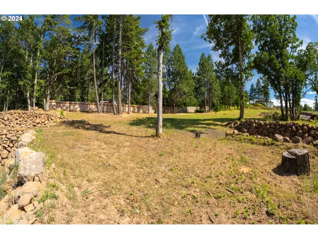 a view of a backyard of the house