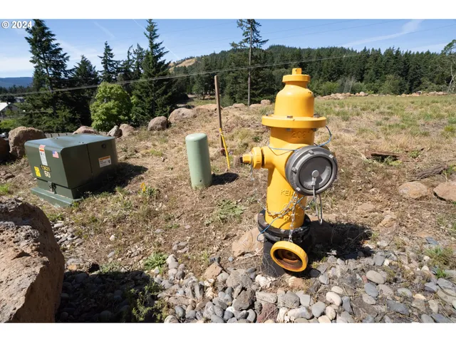 a view of swimming pool with a patio and garden