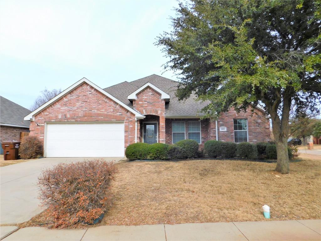 100 McKamy Boulevard Denton, TX 76207 - Photo 1 of 1 a front view of a house with a yard and garage