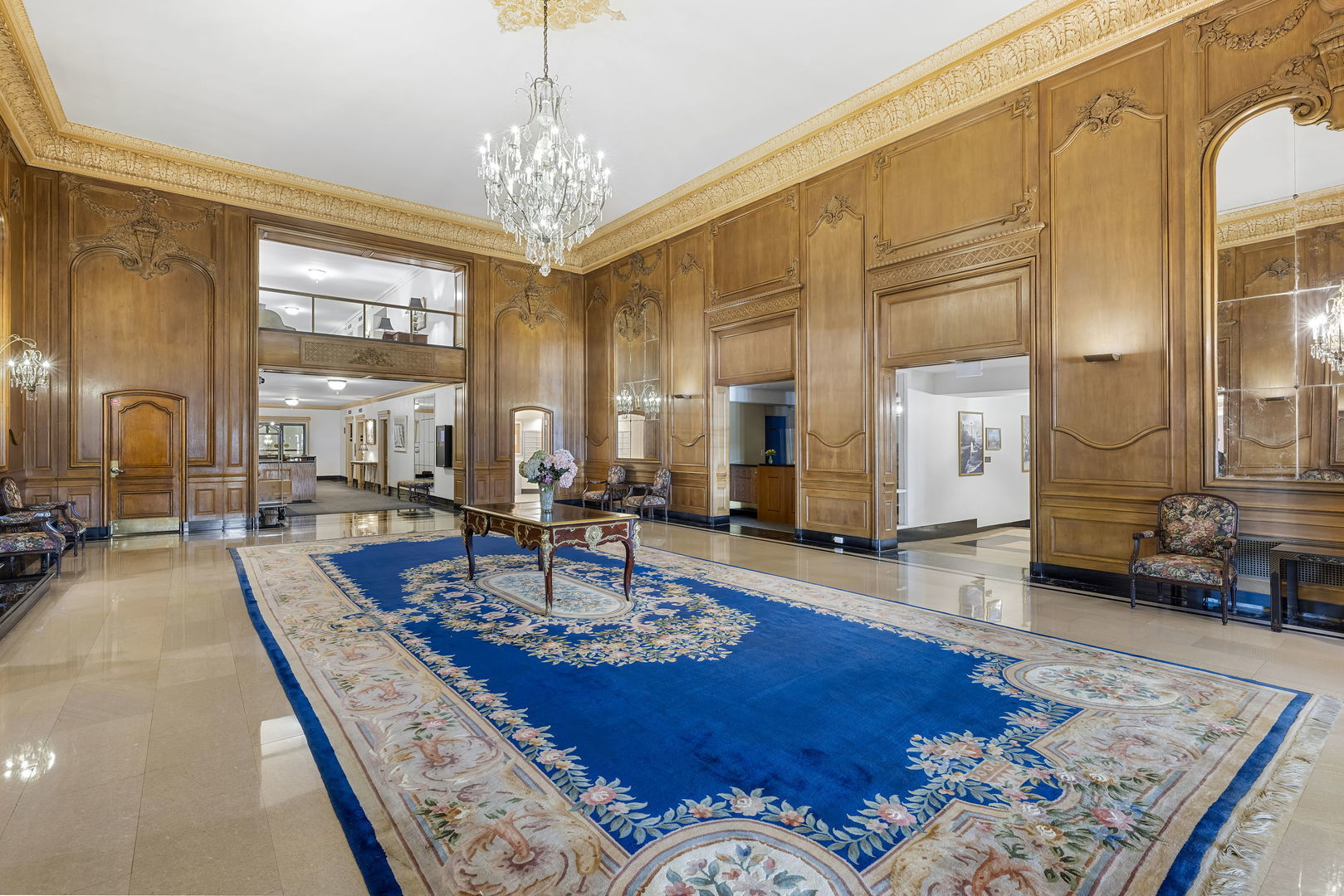 5555 North Sheridan Road, Unit 160304 Chicago, IL 60640 - Photo 3 of 7 a living room with fireplace furniture and a table