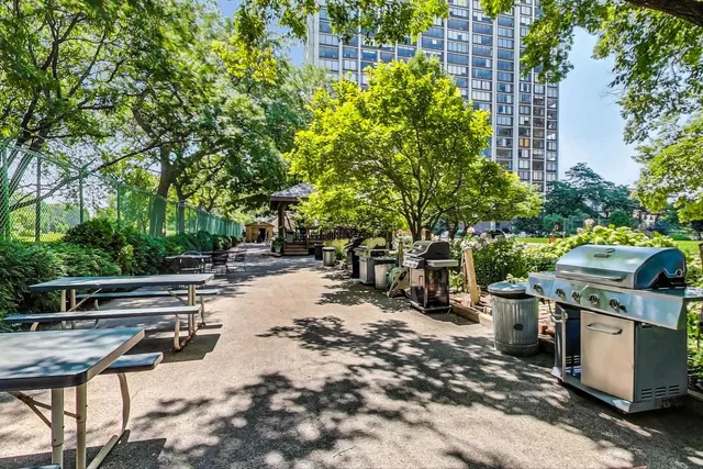 a view of a backyard with sitting area