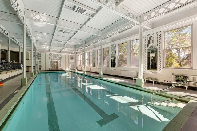 a view of a swimming pool with a patio