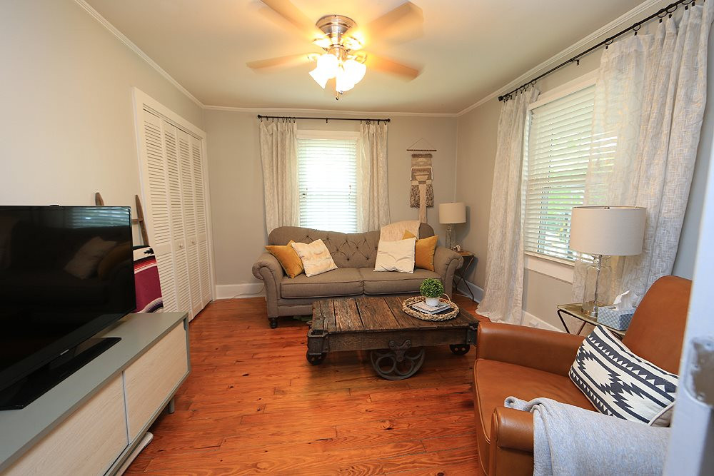 1530 Carson Street Raleigh, NC 27608 - Photo 4 of 21 The second bedroom is off the family room and is currently being used as a den. Features hardwood floors, ceiling fan, vinyl windows and a closet. Bedroom
