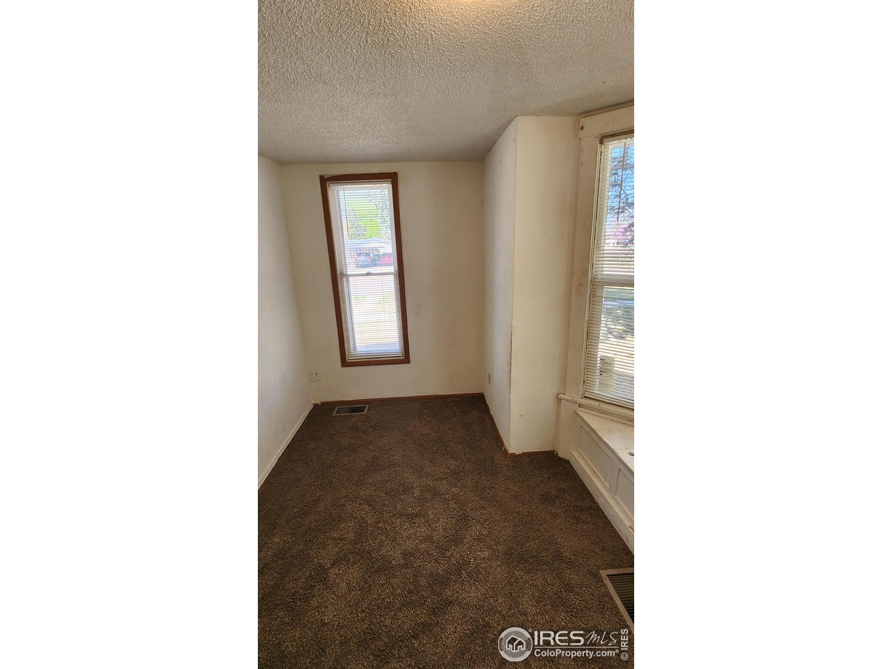 303 South 2nd Street Sterling, CO 80751 - Photo 16 of 37 a view of an empty room with a window