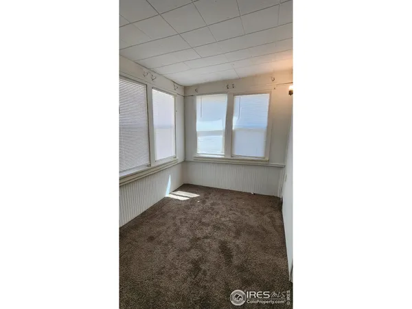 a view of a hallway with windows