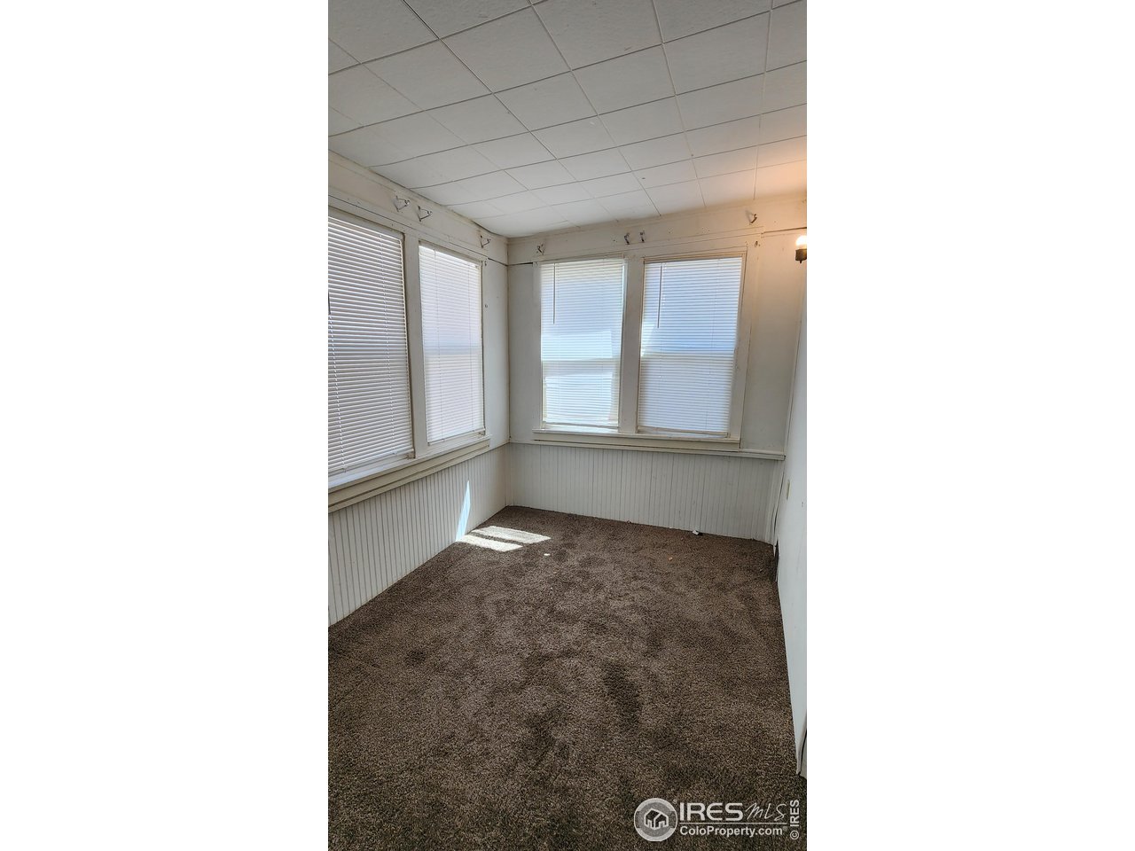 303 South 2nd Street Sterling, CO 80751 - Photo 18 of 37 a view of an empty room with a window