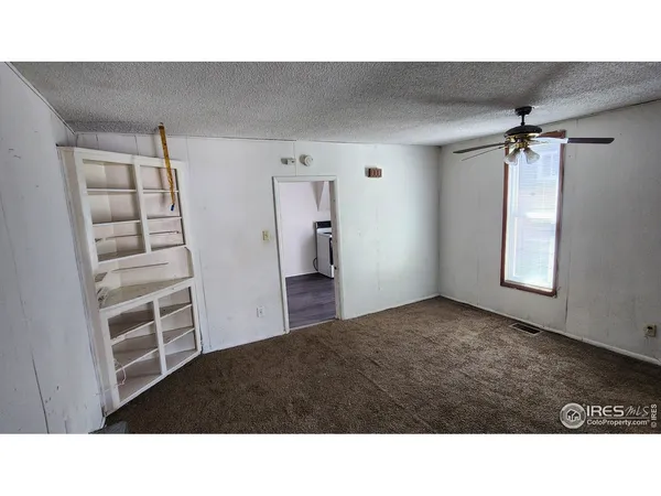 a room with a bed and a walk in closet