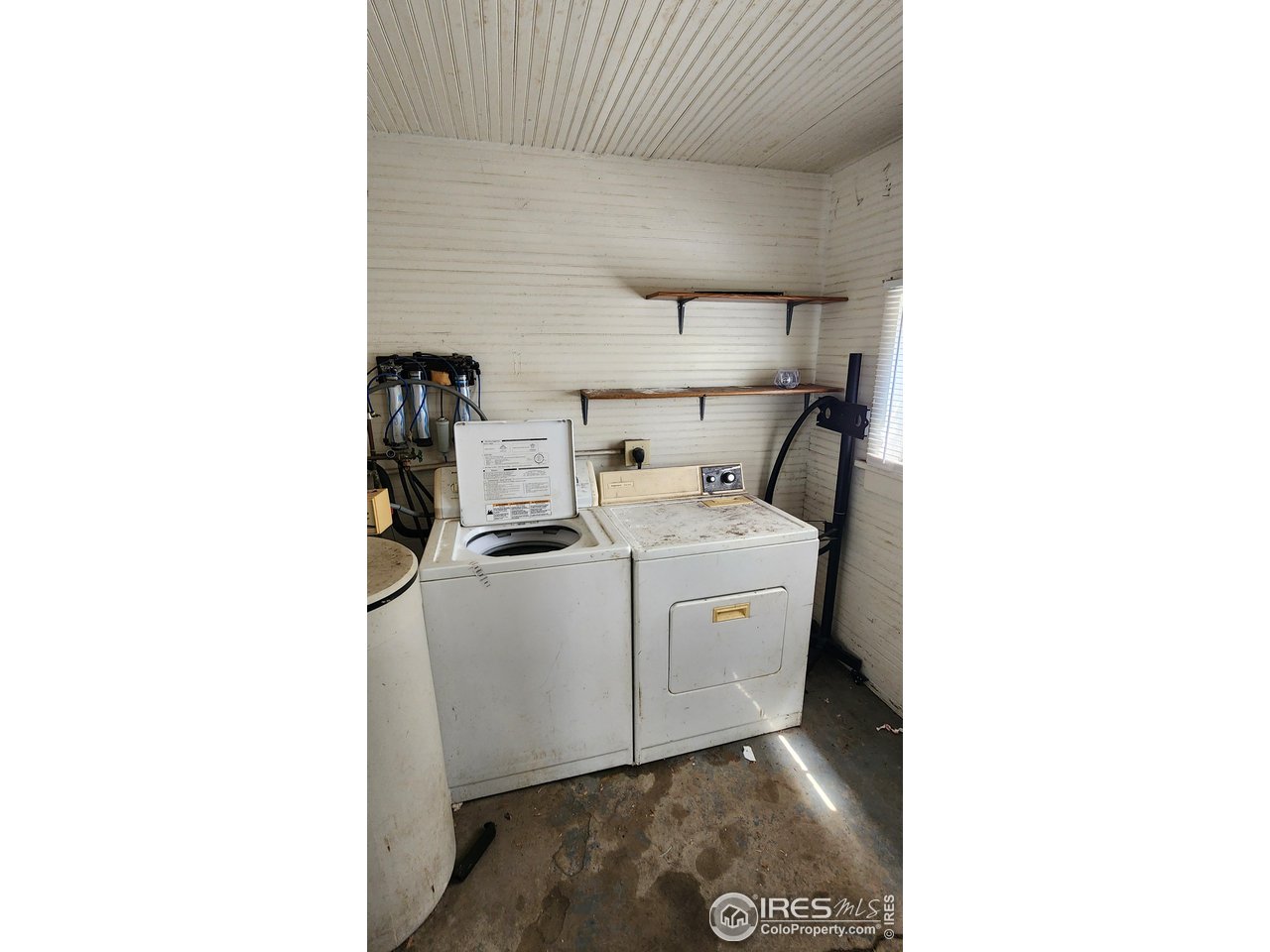 303 South 2nd Street Sterling, CO 80751 - Photo 22 of 37 a utility room with dryer and washer