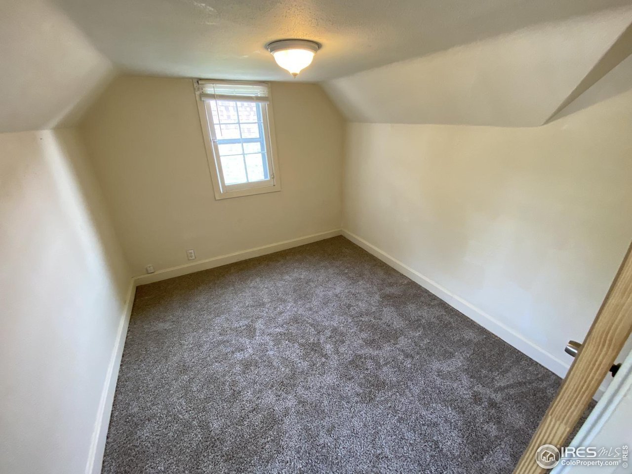 303 South 2nd Street Sterling, CO 80751 - Photo 32 of 37 an empty room with windows