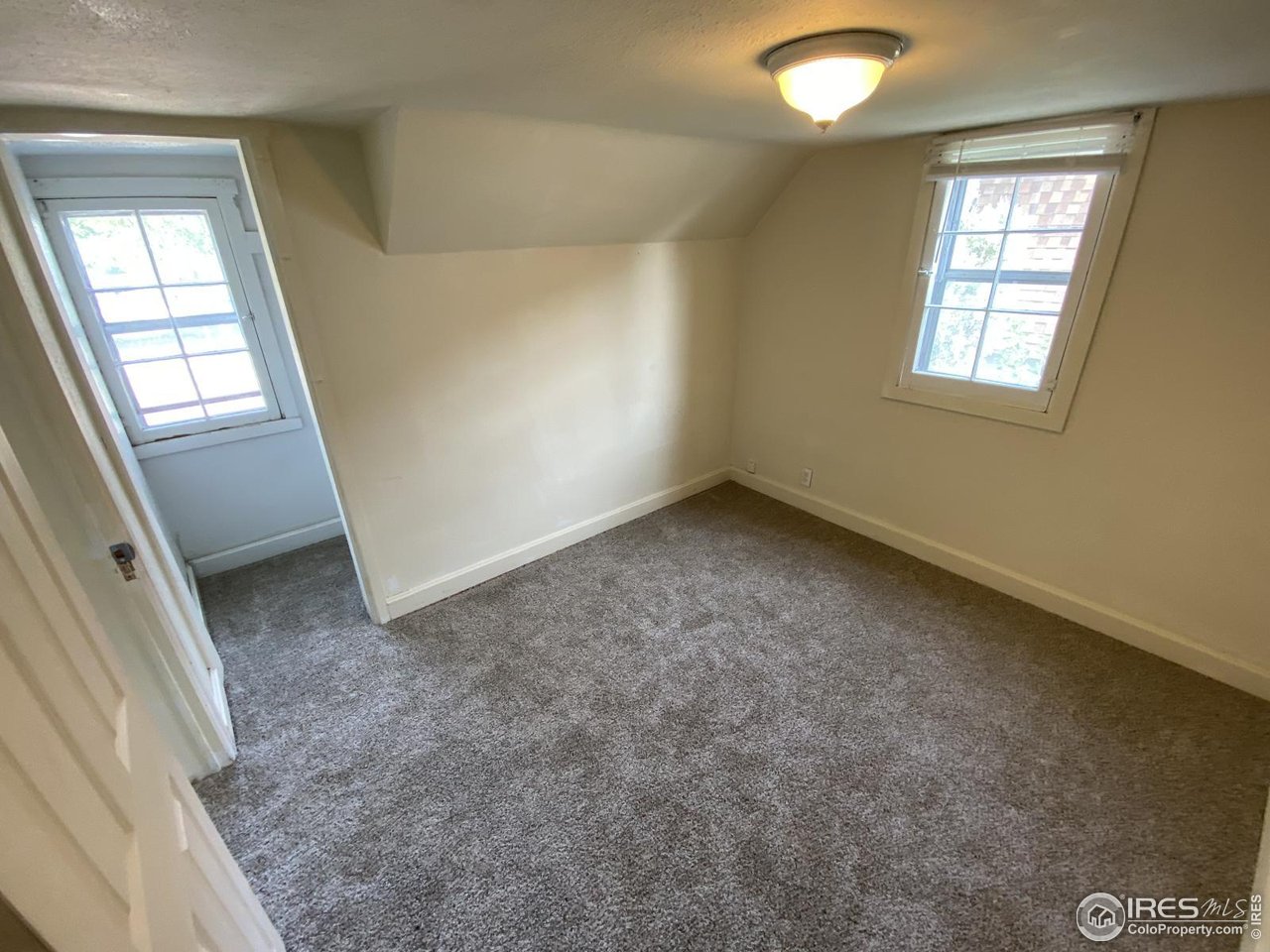 303 South 2nd Street Sterling, CO 80751 - Photo 33 of 37 an empty room with windows