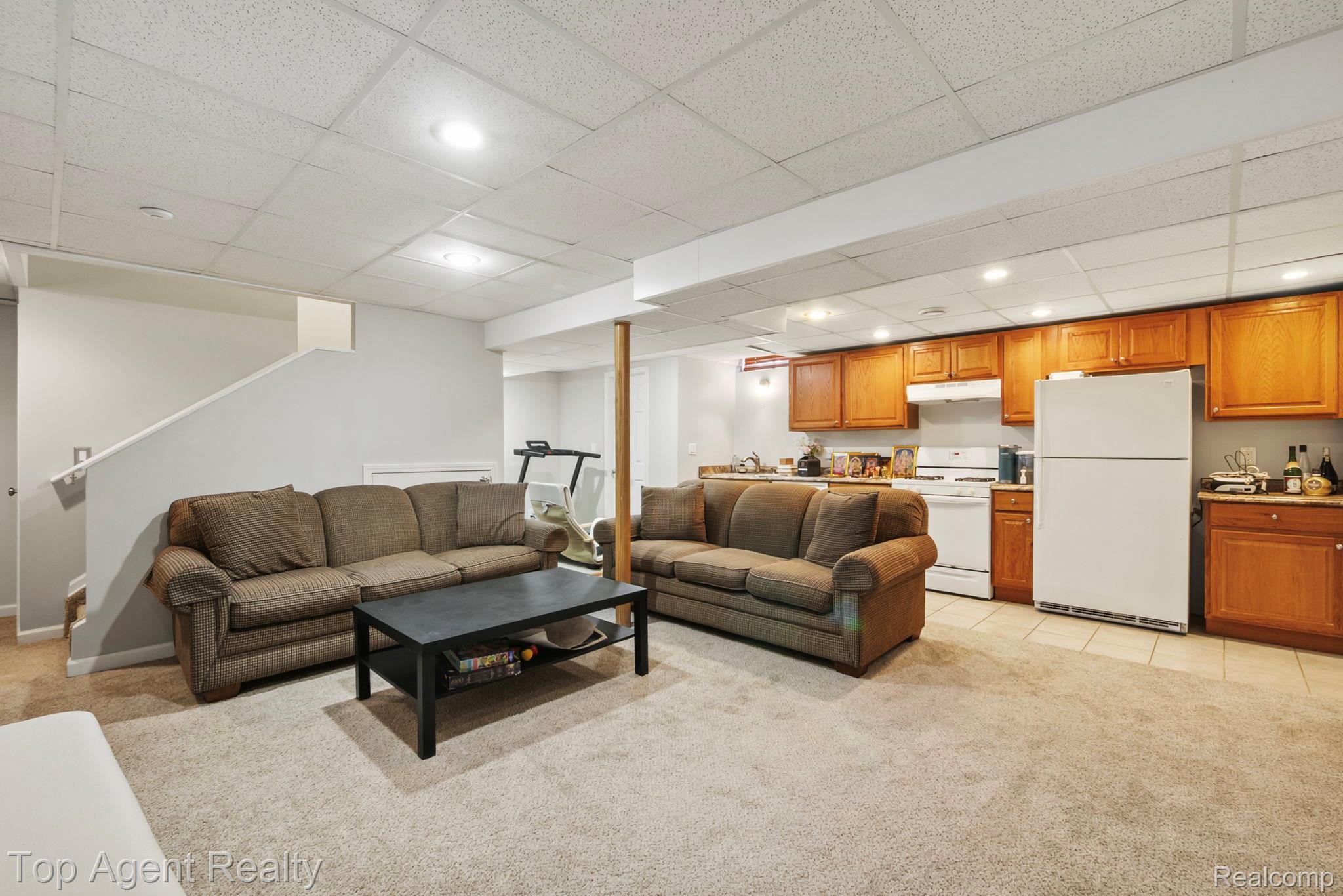 41567 Glade Road, Unit 20 Canton, MI 48187 - Photo 32 of 47 Living room featuring a drop ceiling, light colored carpet, and recessed lighting