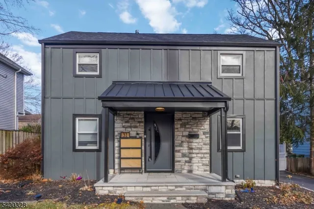 a front view of a house with garage
