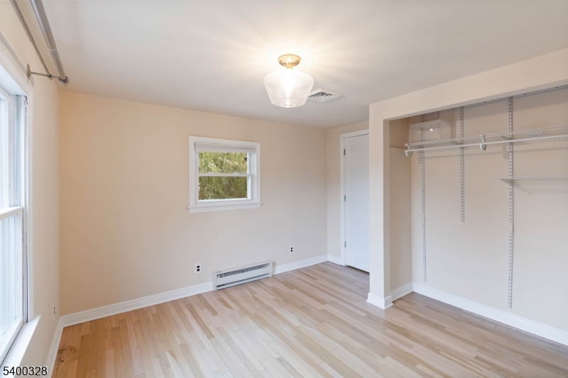 31 Sherman Avenue Hawthorne, NJ 07506 - Photo 13 of 23 an empty room with wooden floor and windows