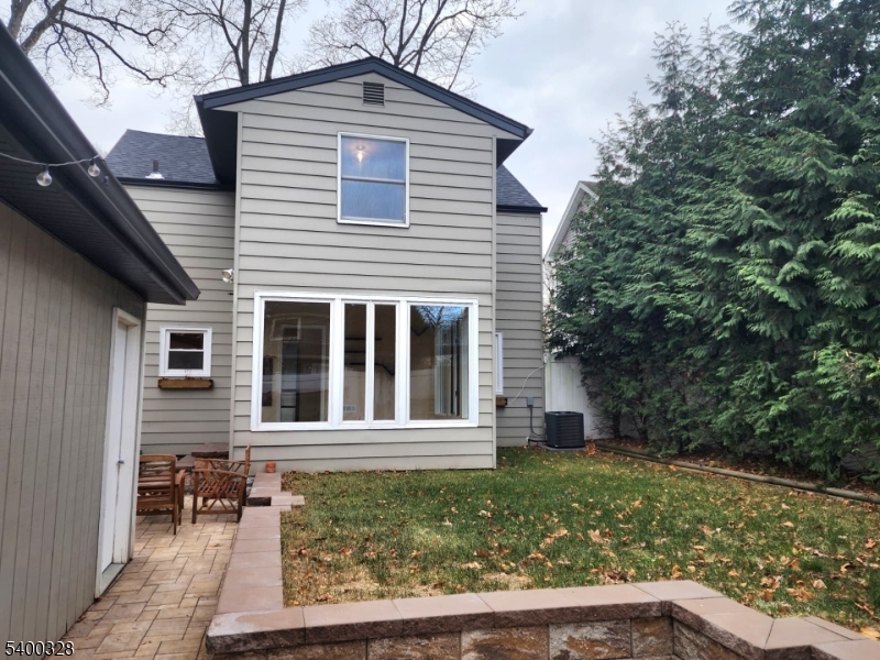 31 Sherman Avenue Hawthorne, NJ 07506 - Photo 15 of 23 a front view of a house with garden