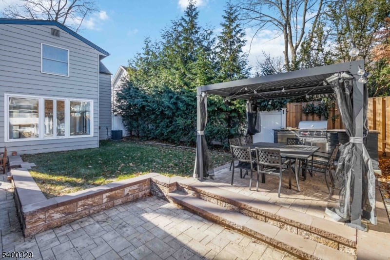 31 Sherman Avenue Hawthorne, NJ 07506 - Photo 17 of 23 a view of a house with backyard and sitting area
