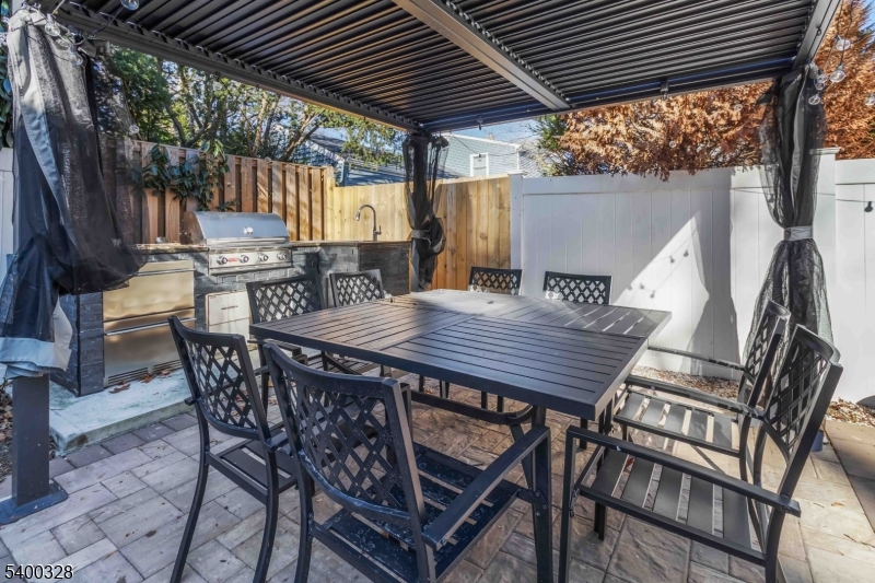 31 Sherman Avenue Hawthorne, NJ 07506 - Photo 20 of 23 a view of a table and chairs in patio