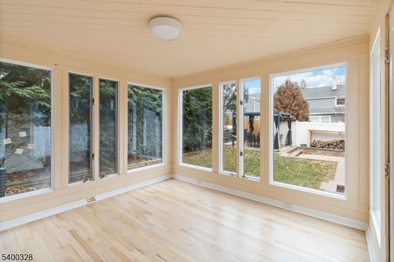 31 Sherman Avenue Hawthorne, NJ 07506 - Photo 10 of 23 a view of an empty room with wooden floor and a window