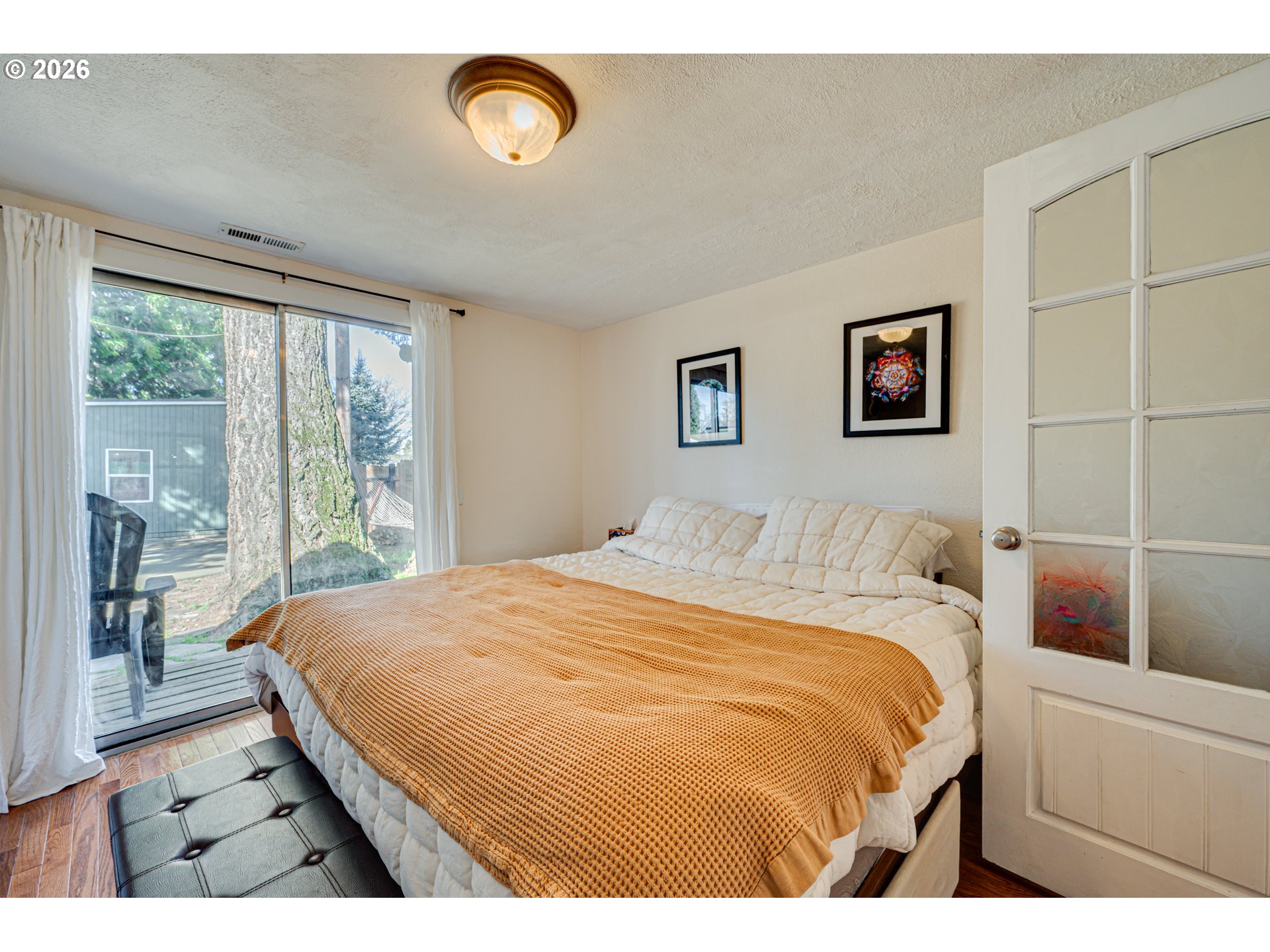 565 9th Street Washougal, WA 98671 - Photo 13 of 24 a bedroom with a bed and a large window