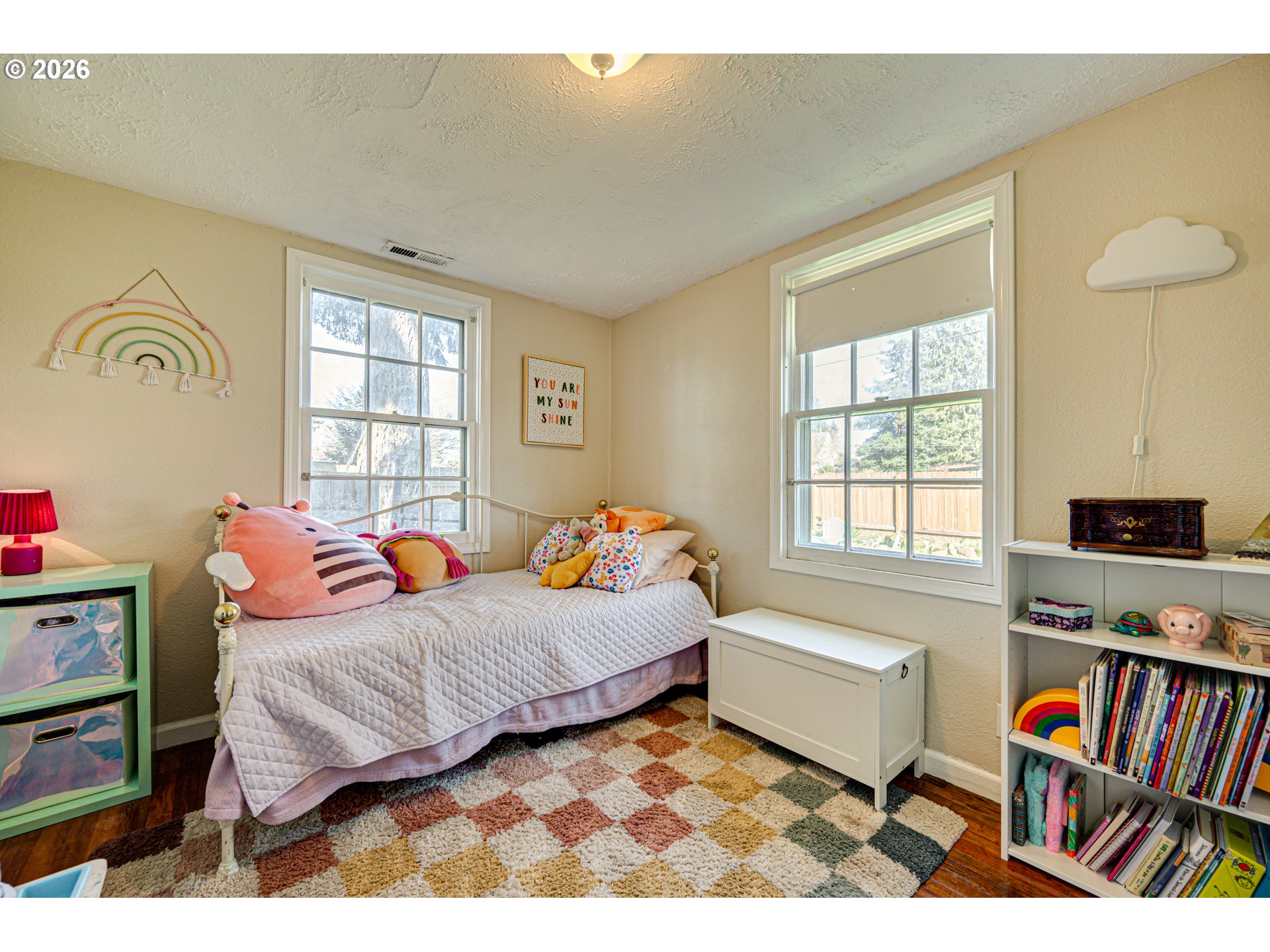 565 9th Street Washougal, WA 98671 - Photo 15 of 24 a bedroom with a bed and a book shelf