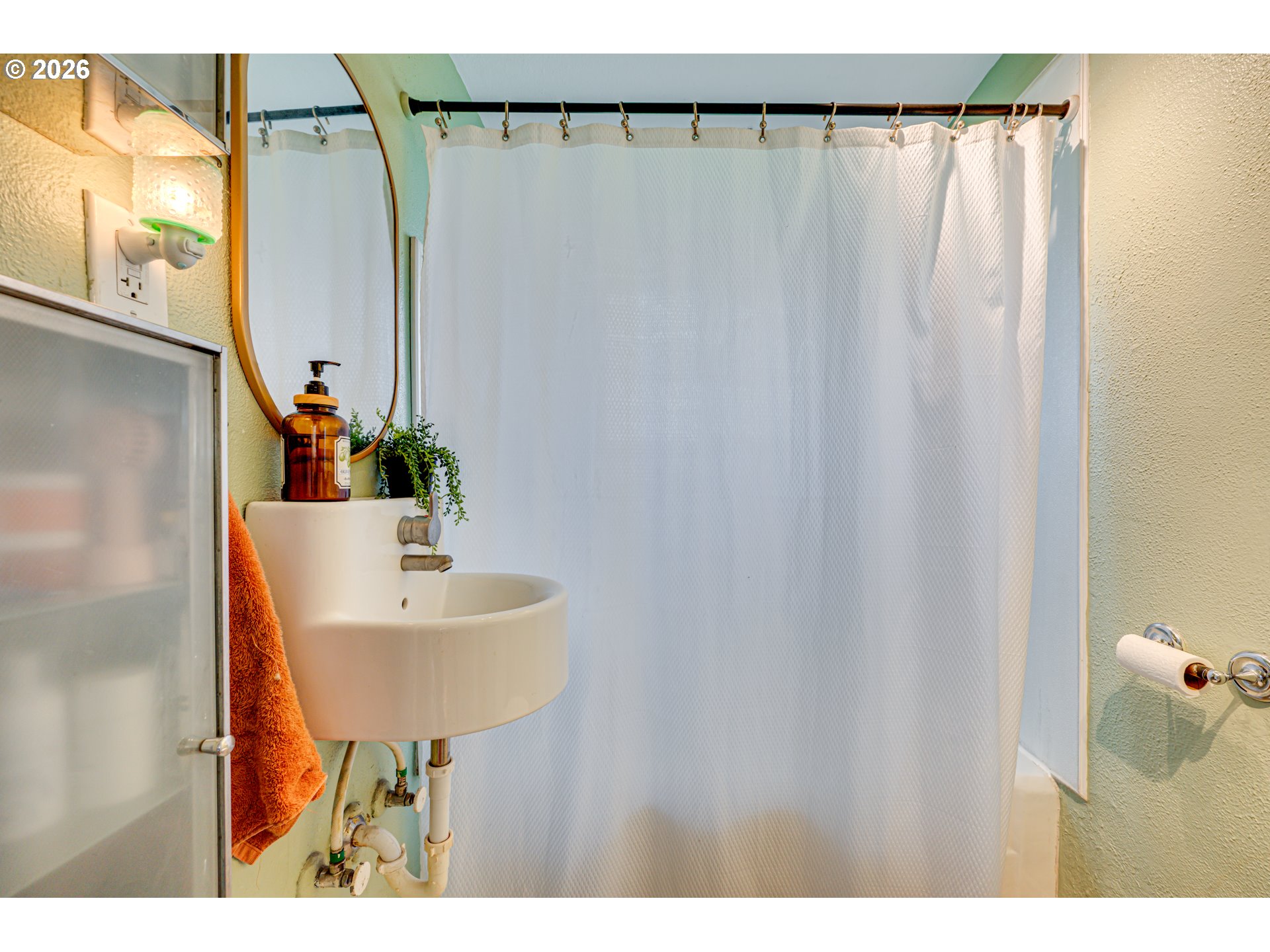 565 9th Street Washougal, WA 98671 - Photo 16 of 24 a bathroom with a sink and a mirror