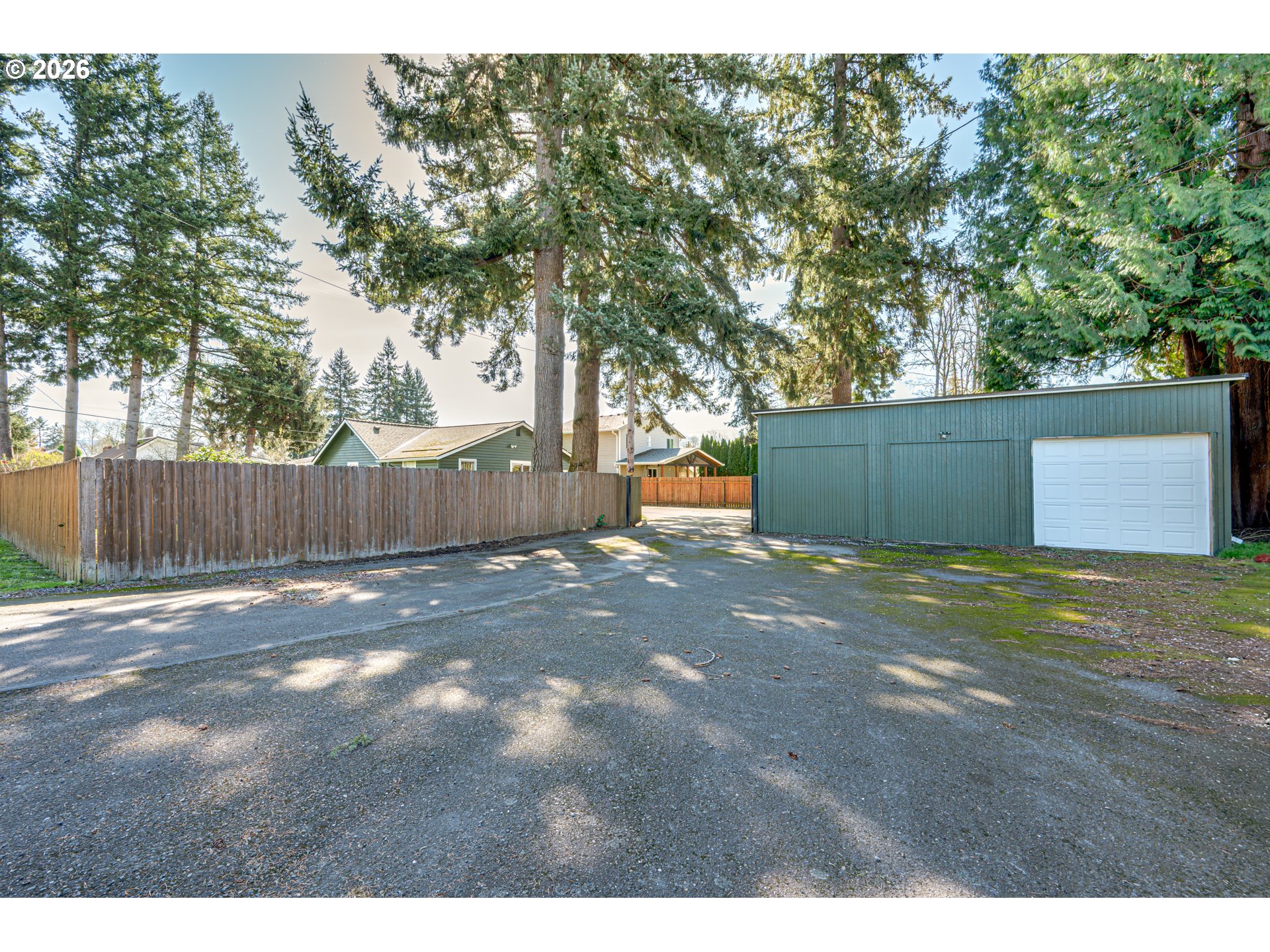 565 9th Street Washougal, WA 98671 - Photo 24 of 24 a backyard of a house with trees and outdoor space