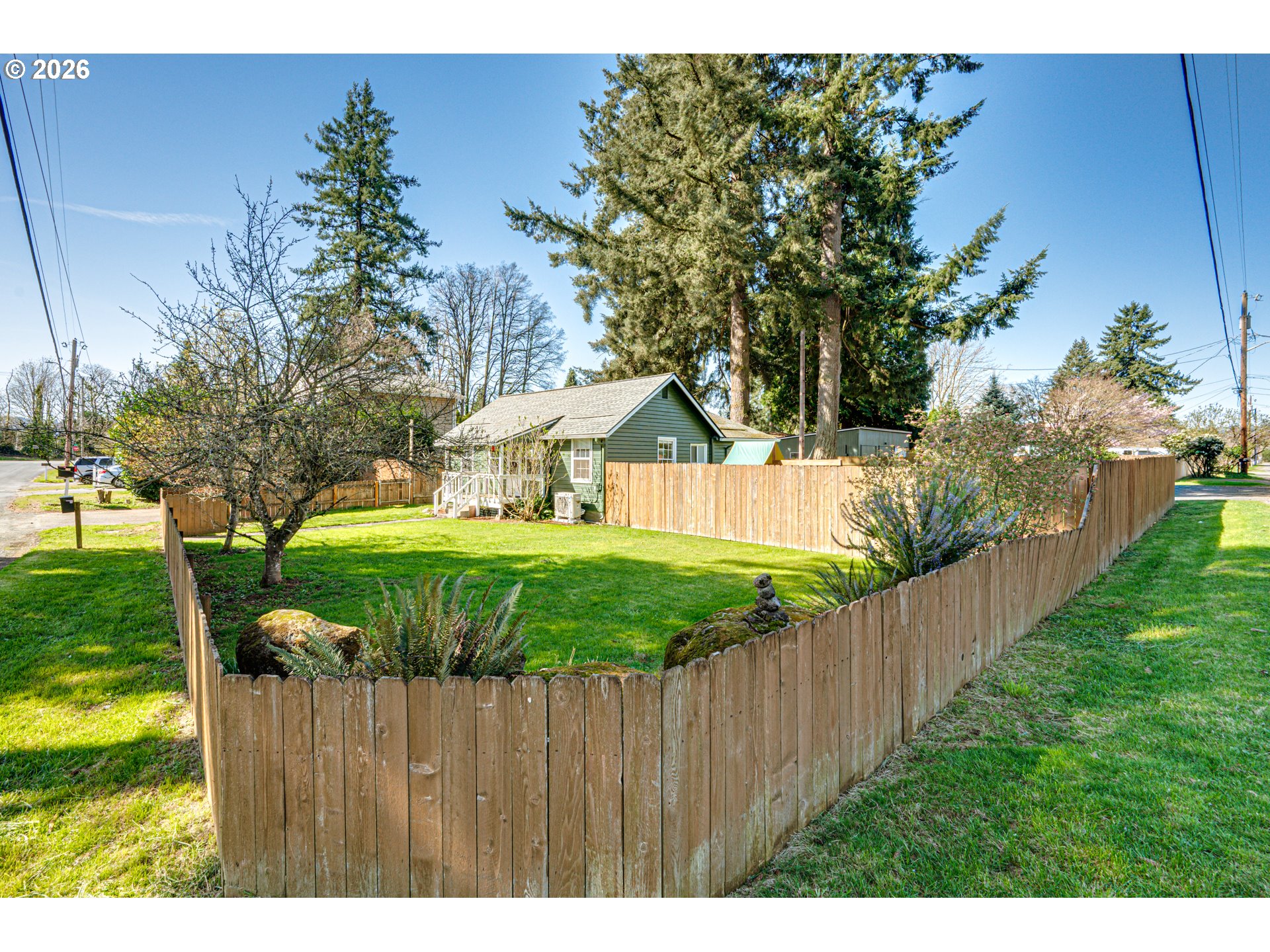 565 9th Street Washougal, WA 98671 - Photo 5 of 24 a view of a backyard with wooden fence