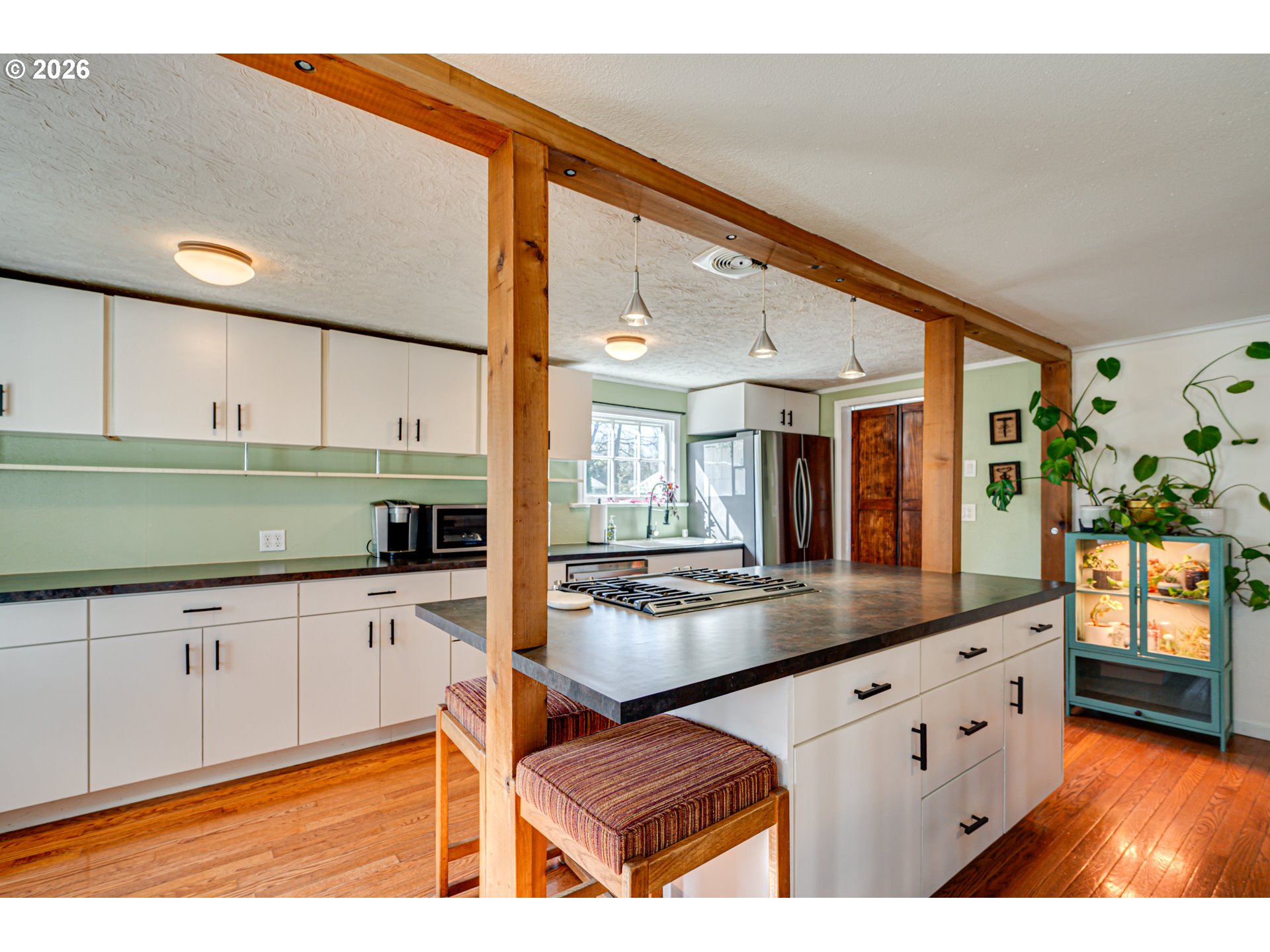 565 9th Street Washougal, WA 98671 - Photo 10 of 24 a kitchen with stainless steel appliances granite countertop a stove and a sink with cabinets
