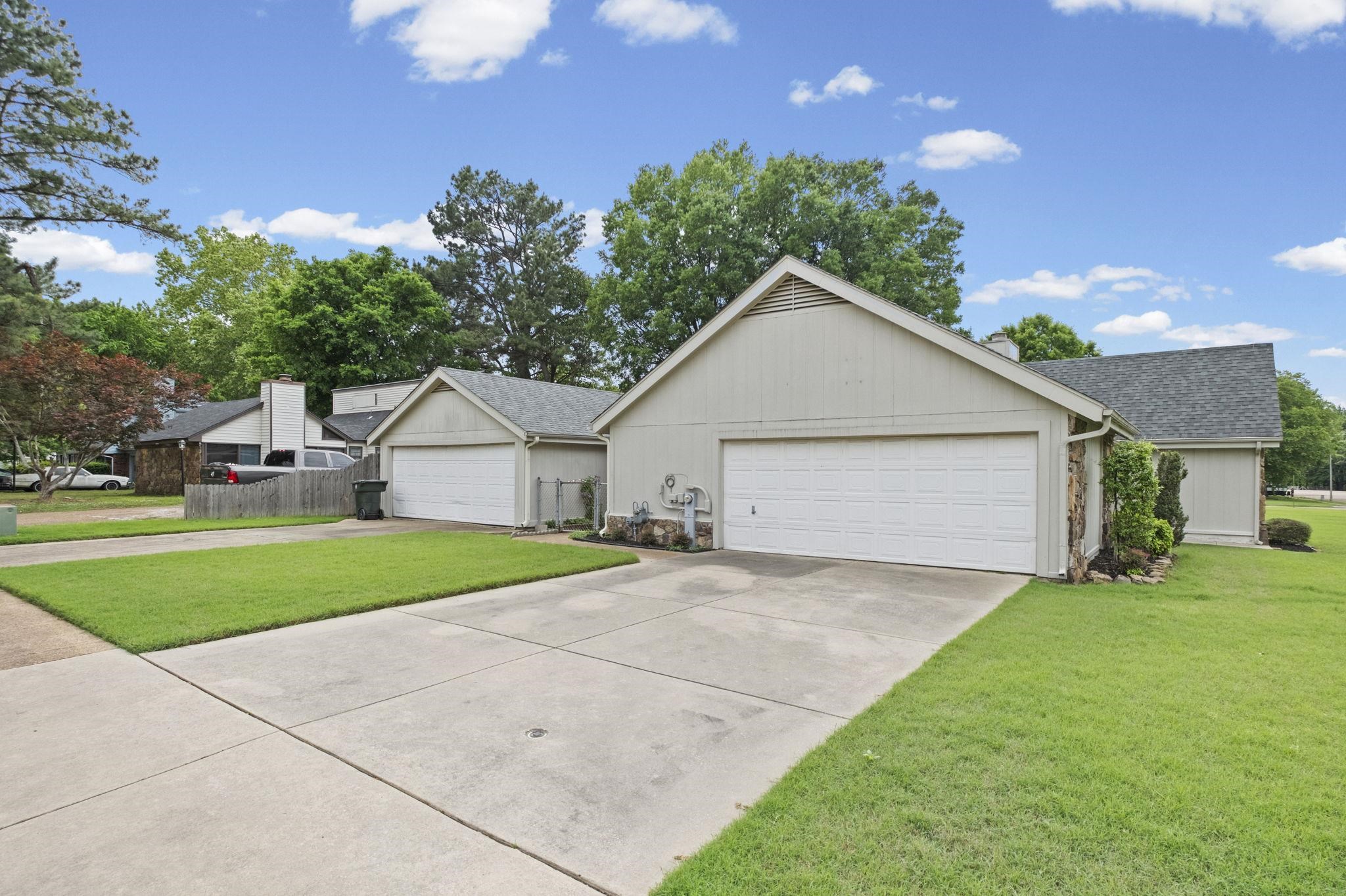 5609 Elmore Road Bartlett, TN 38134 - Photo 2 of 29 2 Car Attached and separate 3 Car Attached Garage that is heated and cooled and his it's own separate driveway.