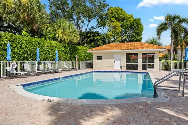 a view of a house with swimming pool