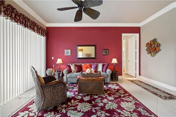 a living room with furniture and a rug
