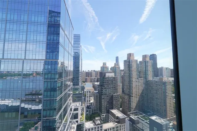 a view of a city with tall buildings