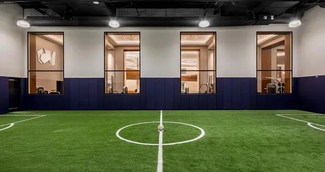 a view of a hall with kitchen and car