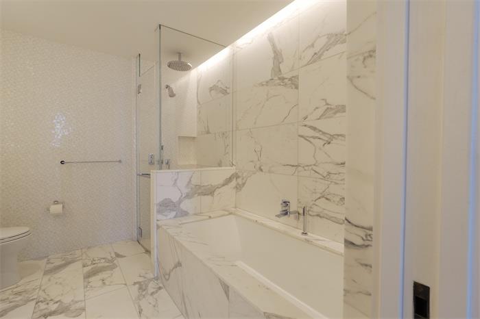 30 Riverside Boulevard, Unit 29D Manhattan, NY 10069 - Photo 8 of 25 a bathroom with a bathtub and shower