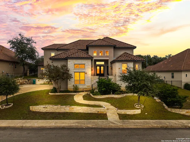 a view of a house with swimming pool and sitting area